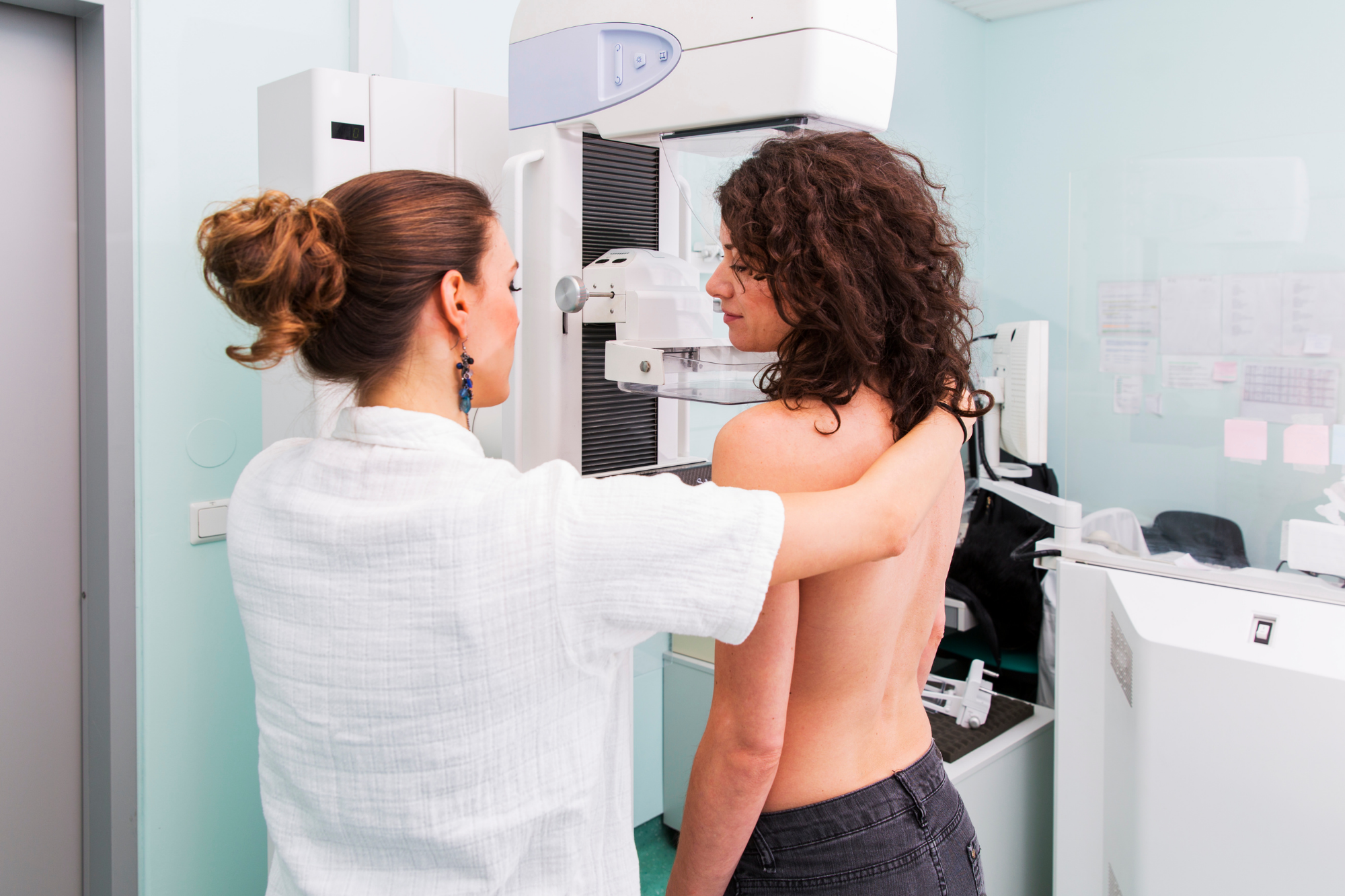 Specialist Conducting A Chest Xray on Female Patient | Mammogram Clinic Near Me | Direct Radiology 