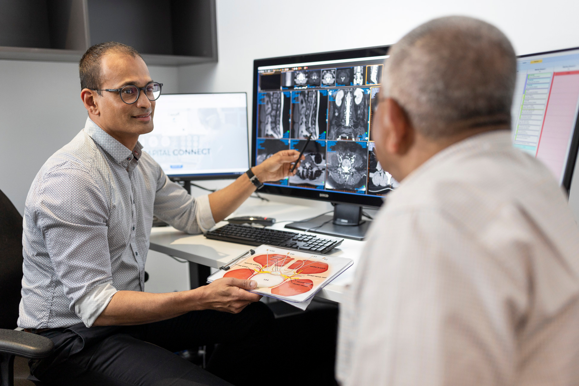 Doctor Explaining Medical Xray Results To A Patient | Qscan Radiology Clinics | Direct Radiology